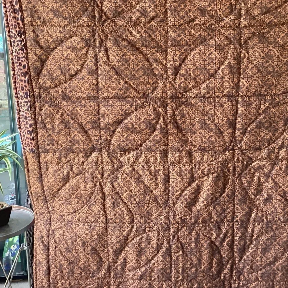 Patchwork Quilt with Blue and Brown Tones